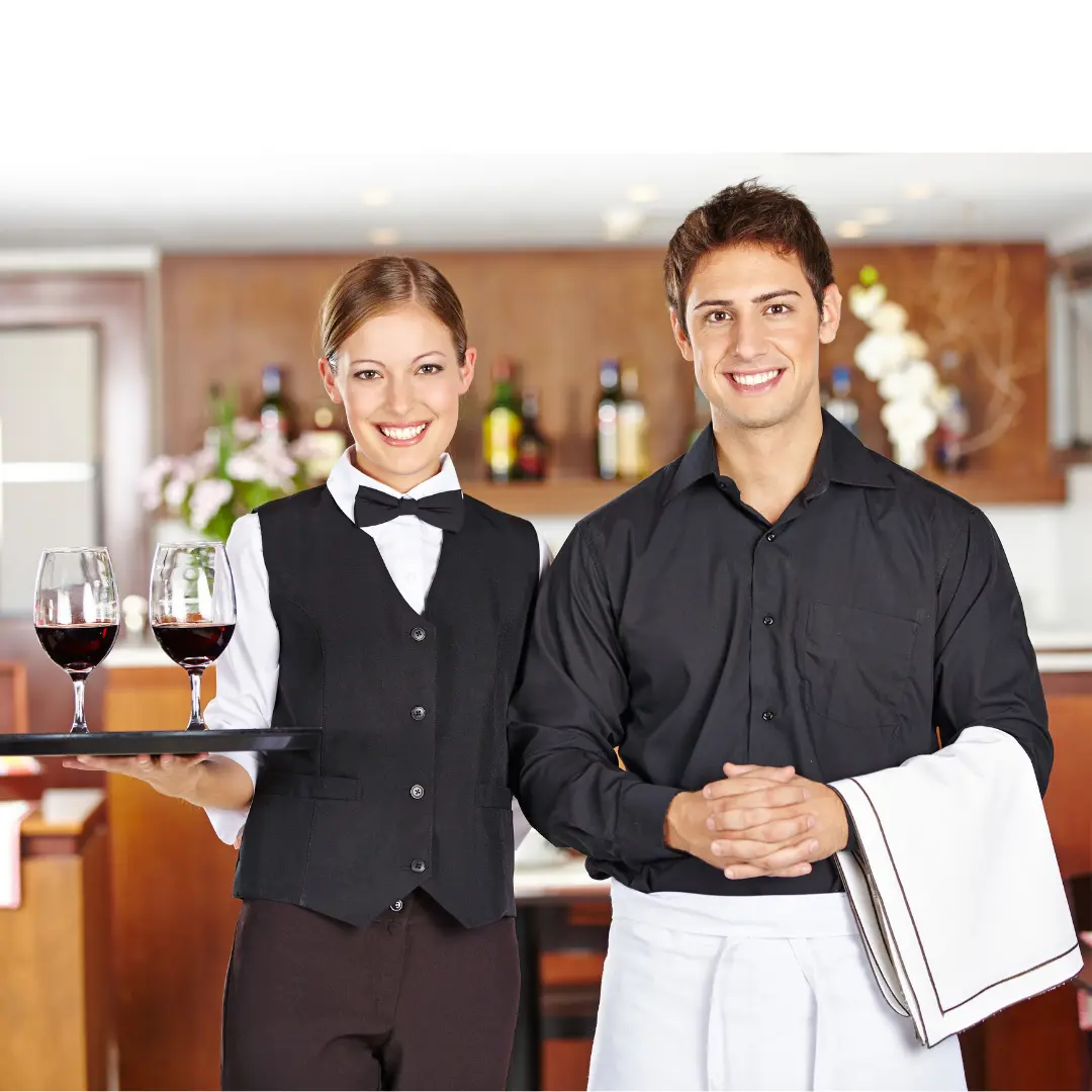Hospitality staff wearing sustainable polos and aprons – eco-friendly uniform set for retail, cafés and customer-facing teams in Ireland.