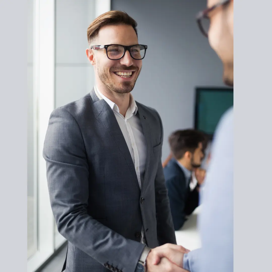 Sustainable Corporate Reception Team Reception staff wearing sustainable corporate uniforms welcoming clients in a professional office setting.